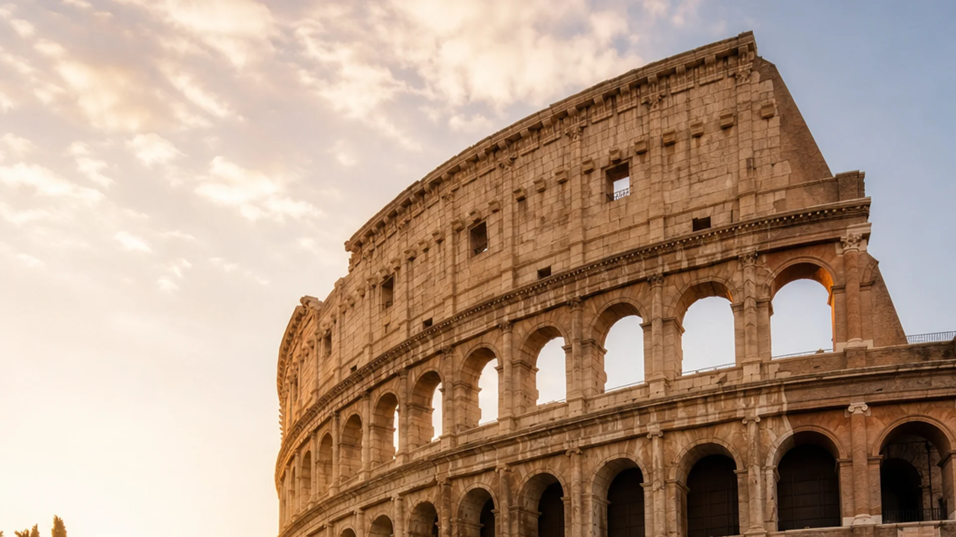 A photorealistic 16:9 wide-angle scene of the Roman Colosseum at golden hour, shot from street level with warm evening light across the ancient stone arches and a quiet foreground cobblestone street. Alt: Day-by-day Italy itinerary starting point at the Colosseum in Rome.